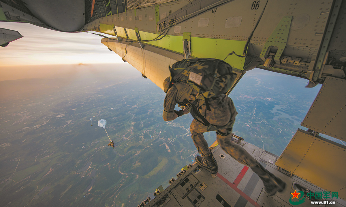 A special operations soldier assigned to the Thunder Commando of the PLA Air Force airborne troops jumps out of the aircraft during a parachuting training exercise in mid-summer, 2022. The exercise, lasting for several days, aims to hone the troops' combat capabilities in parachuting, long-range penetration and precision strike operations in the complex environment. (eng.chinamil.com.cn/Photo by Gu Xixi, Xu Jiawang and Guo Shuai)