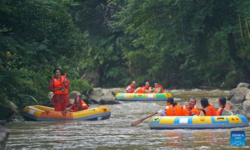 People enjoy drifting at a canyon in Meiling scenic spot in Nanchang, capital of east China's Jiangxi Province on Aug. 2, 2022. (Xinhua/Wan Xiang)