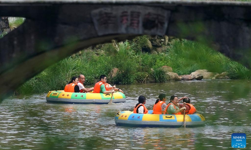 People enjoy drifting at a canyon in Meiling scenic spot in Nanchang, capital of east China's Jiangxi Province on Aug. 2, 2022. (Xinhua/Wan Xiang)