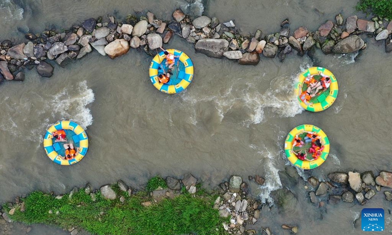 Aerial photo taken on Aug. 2, 2022 shows people enjoying drifting at a canyon in Meiling scenic spot in Nanchang, capital of east China's Jiangxi Province. (Xinhua/Wan Xiang)