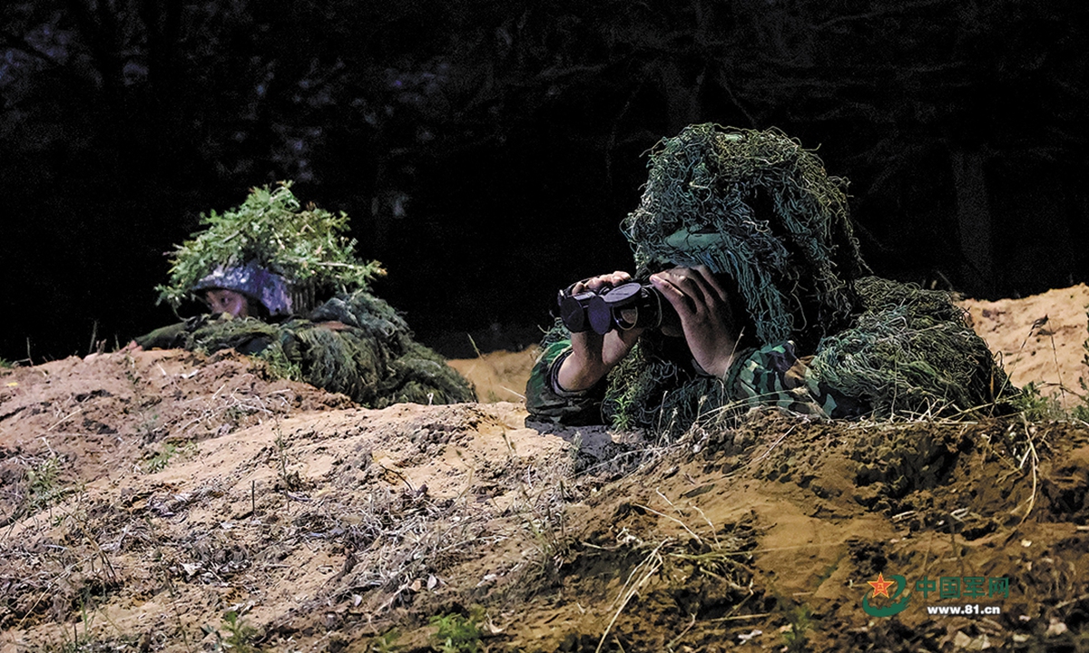 Scouts assigned to a brigade under the PLA 81st Group Army reconnoiter the enemy deployment under cover of darkness during a day-and-night live-fire training exercise at a training range on July 11, 2022. (eng.chinamil.com.cn/Photo by Wu Chao, Liu Qiang and Liang Tianchi)