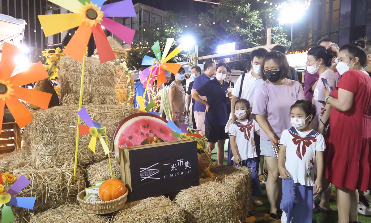 Residents shop at a market in Changning district, Shanghai on August 7, 2022. The market is part of 
