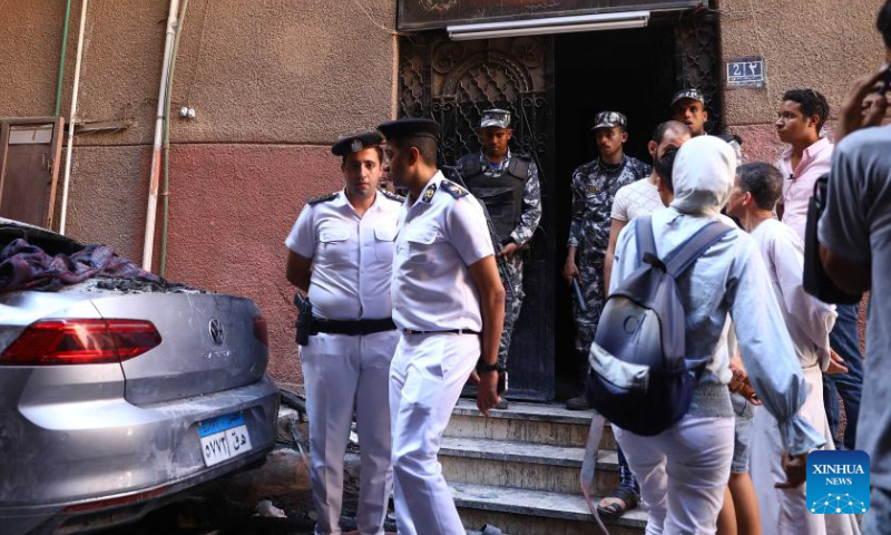 Policemen work at the fire site at a Coptic church in Giza Province, Egypt, on Aug. 14, 2022. At least 41 people were killed and 12 injured in a massive fire that broke out in a Coptic church in Egypt's Giza Province on Sunday, the Egyptian Health Ministry said. Photo: Xinhua