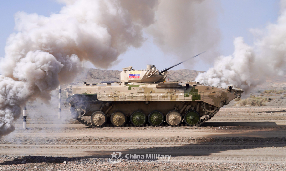 An infantry fighting vehicle of the Venezuelan team passes through wall of fire in the final round of individual race of Suvorov Onslaught contest in Korla, China's Xinjiang Uygur Autonomous Region, on August 18, 2022. Photo:China Military