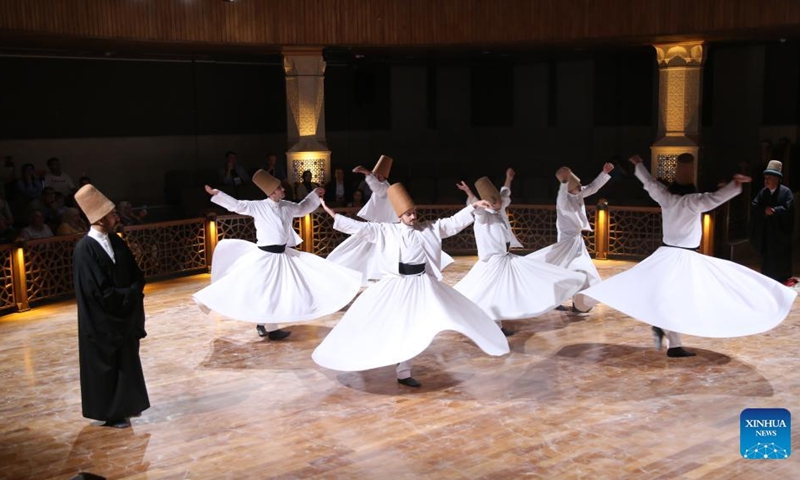 People perform the Sufi whirling dance in Konya, Türkiye, on Aug. 10, 2022.(Photo: Xinhua)