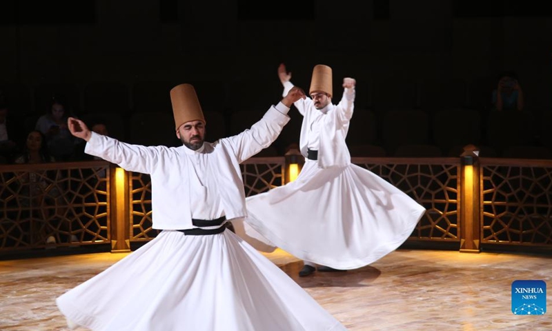 People perform the Sufi whirling dance in Konya, Türkiye, on Aug. 10, 2022.(Photo: Xinhua)