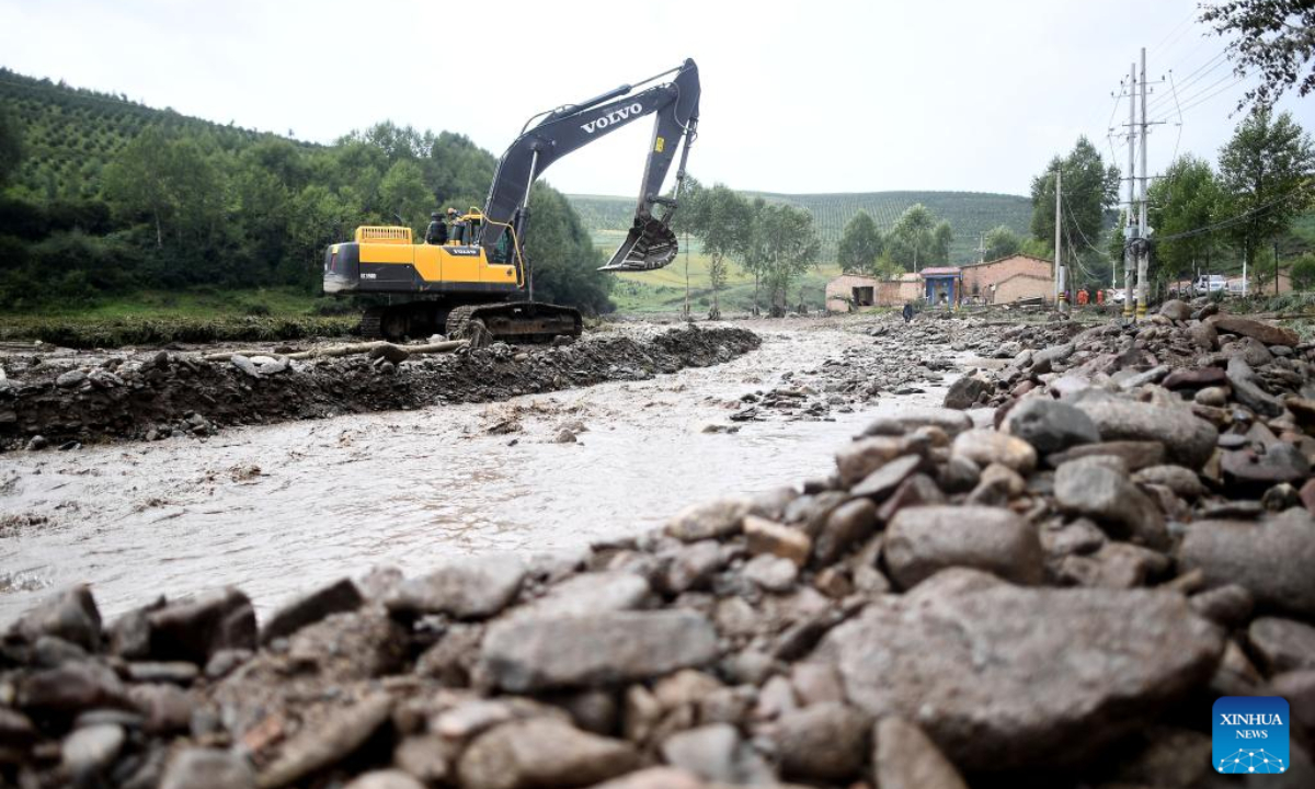 Rescuers dredge a river at Shadai Village, Qingshan Township of Datong Hui and Tu Autonomous County in northwest China's Qinghai Province, Aug 18, 2022. Photo:Xinhua