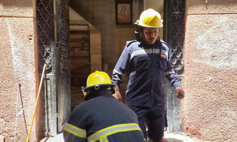 Fire fighters work at a fire site in Giza Province, Egypt, on Aug. 14, 2022. At least 41 people were killed and 12 wounded in a massive fire that broke out in a Coptic church in Egypt's Giza Province on Sunday, the Egyptian Health Ministry said. Photo: Xinhua