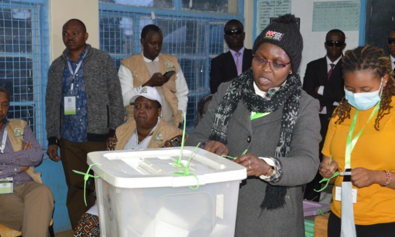 An official of Kenya's Independent Electoral and Boundaries Commission opens a ballot box for counting at a polling station in Nairobi Aug. 9, 2022. Kenya on Tuesday held general elections for the country's fifth president, members of the National Assembly, senators, and county governors. (Photo by Charles Onyango/Xinhua)