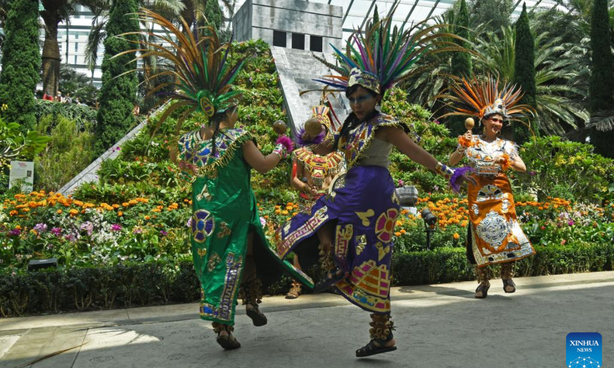 Traditionally-dressed Mexican dancers perform on the opening day of Hanging Gardens - Mexican Roots floral display, held at Flower Dome of the Singapore's Gardens by the Bay on Aug 19, 2022. Photo:Xinhua