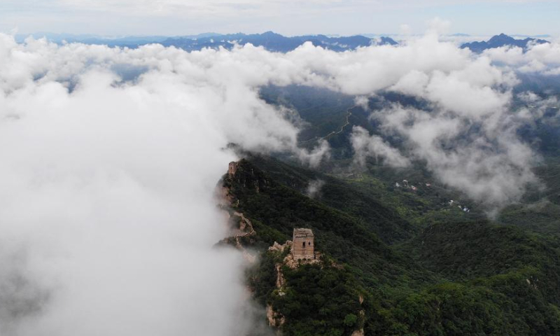 Aerial photo taken on Aug. 9, 2022 shows the Jinshanling section of the Great Wall amid clouds in Luanping County, north China's Hebei Province. (Xinhua/Luo Xuefeng)