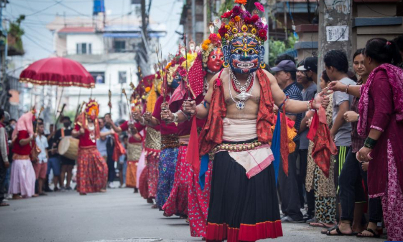 People take part in a parade during the Khadga Jatra festival in Kathmandu, Nepal, Aug. 14, 2022. Photo: Xinhua