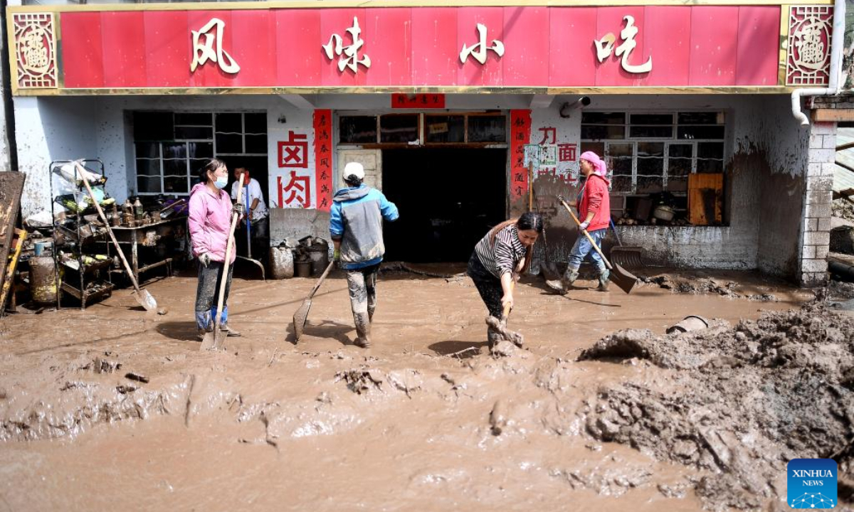 Local residents remove sludge off their property in Qingshan Township of Datong Hui and Tu Autonomous County in northwest China's Qinghai Province, Aug 18, 2022. Photo:Xinhua