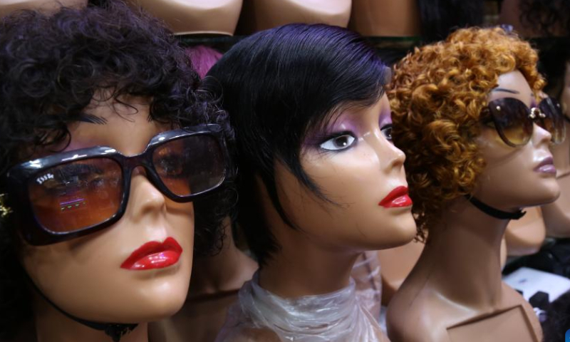 Wigs are displayed at a shop in Dar es Salaam, Tanzania, on Aug. 13, 2022.  Photo: Xinhua