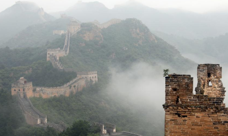 Photo taken on Aug. 9, 2022 shows the Jinshanling section of the Great Wall amid clouds in Luanping County, north China's Hebei Province. (Xinhua/Luo Xuefeng)