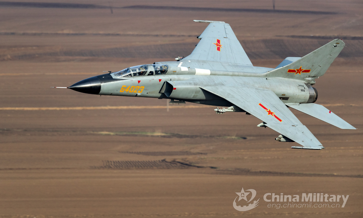 A JH-7 fighter bomber attached to an aviation brigade of the air force under the PLA Northern Theater Command soars through a valley during an extremely low altitude flight training exercise on April 25, 2019. Photo:China Military
