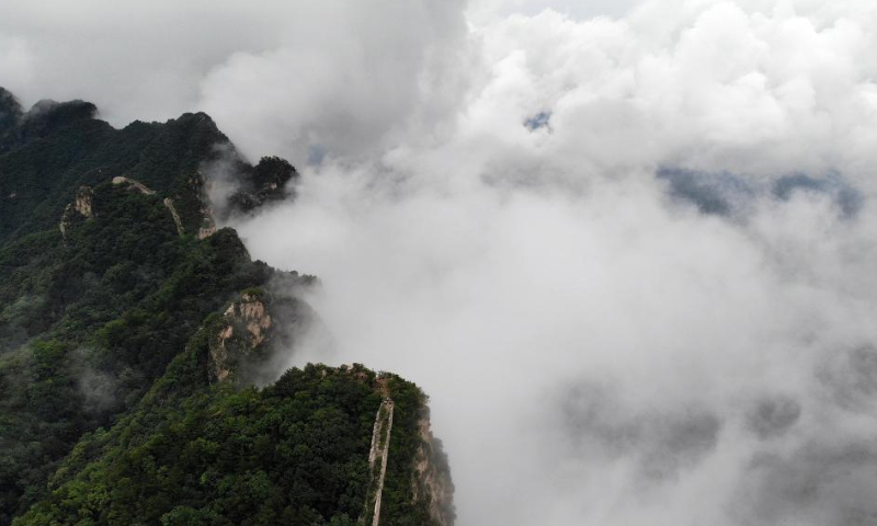 Aerial photo taken on Aug. 9, 2022 shows the Jinshanling section of the Great Wall amid clouds in Luanping County, north China's Hebei Province. (Xinhua/Luo Xuefeng)