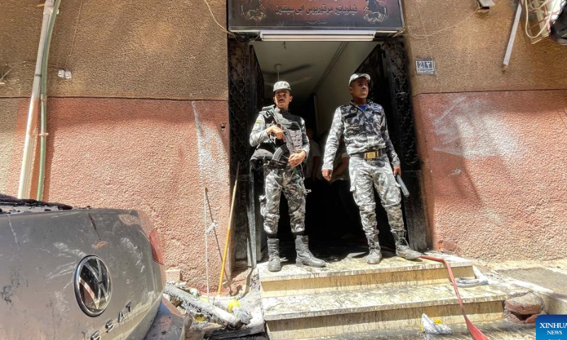 Policemen work at the fire site at a Coptic church in Giza Province, Egypt, on Aug. 14, 2022. At least 41 people were killed and 12 injured in a massive fire that broke out in a Coptic church in Egypt's Giza Province on Sunday, the Egyptian Health Ministry said. Photo: Xinhua