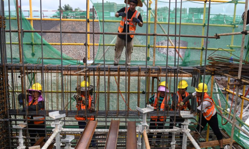 Workers bind rebar at the construction site of Yulin North Railway Station in Yulin, south China's Guangxi Zhuang Autonomous Region, Aug. 12, 2022. Yulin North Railway Station, covering an area of 49,975 square meters, is one of the seven stations along the Nanning-Yulin high-speed railway with a designed speed of 350 kilometers per hour. Photo: Xinhua