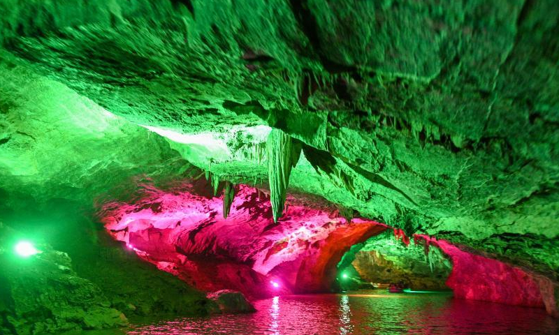 Colored lights illuminate the geological formations at the Benxi Water Cave, a large-scale underground karst, in Benxi, northeast China's Liaoning Province, Aug. 10, 2022. (Photo: China News Service/Yu Haiyang)
Developed about 500,000 years ago, the cave has more than 400,000 cubic meters internal space and a total length of 5,800 meters. Comprising a dry cave and a water cave, it is the world's longest underground karst cave with water.