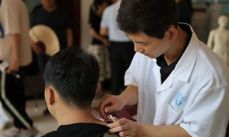 A man receives acupuncture treatment at a village medical service center in Tongchuan, Northwest China's Shaanxi Province. Photo: Xiao Yi/China Economic Weekly