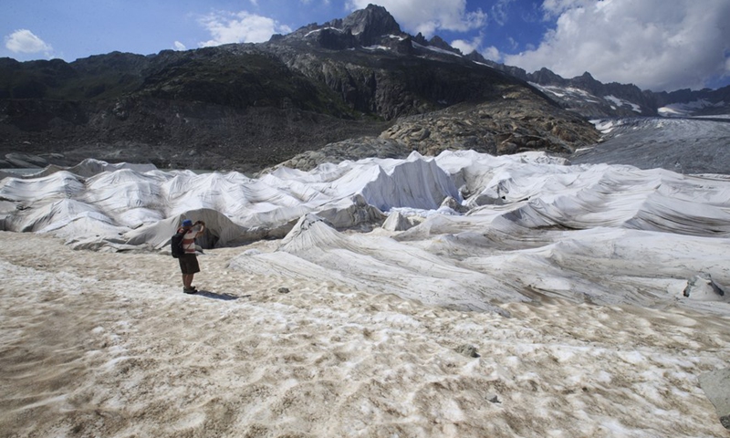 Photo taken on Aug. 5, 2018 shows the Rhone Glacier covered with white blankets near the Furka Pass in Switzerland.(Photo: Xinhua)