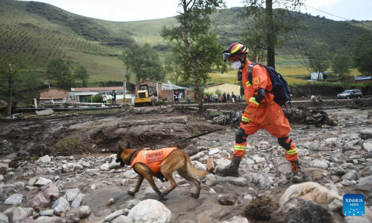 A rescuer carries out search and rescue work in Shadai Village, Qingshan Township of Datong Hui and Tu Autonomous County, northwest China's Qinghai Province, Aug 18, 2022.Photo:Xinhua