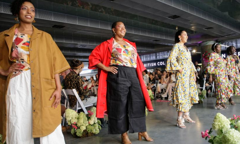 Models present creations during the free public fashion show at Robson Square in Vancouver, British Columbia, Canada, Aug. 12, 2022. Featuring nine local designers and three downtown retailers, downtown's first free-to-the-public fashion show was hosted in downtown Vancouver to showcase the diversity and inclusiveness of the local fashion industry. Photo: Xinhua
