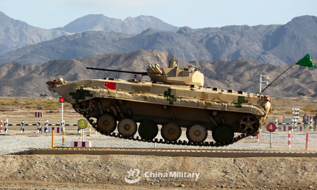 An infantry fighting vehicle of the Chinese team crosses a treadway bridge setup in the final round of individual race of Suvorov Onslaught contest in Korla, China's Xinjiang Uygur Autonomous Region, on August 18, 2022. Photo:China Military