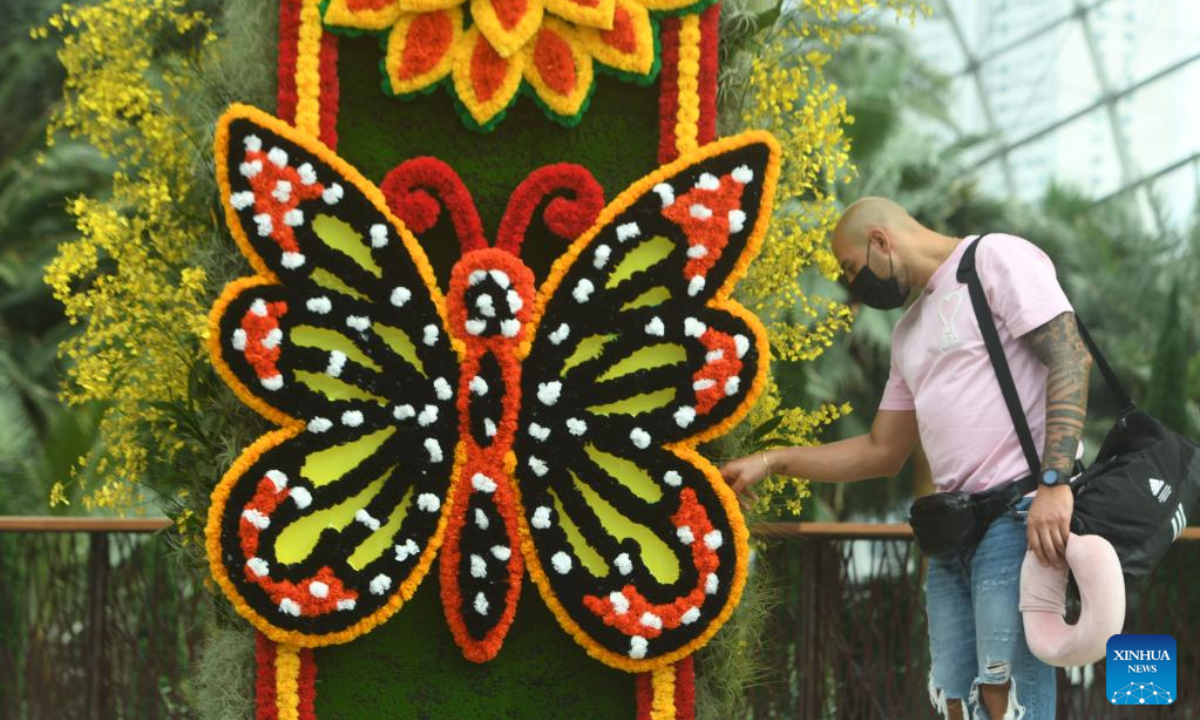 A tourist views the floral and cultural exhibits during the opening day of Hanging Gardens - Mexican Roots floral display, held at Flower Dome of the Singapore's Gardens by the Bay on Aug 19, 2022. Photo:Xinhua