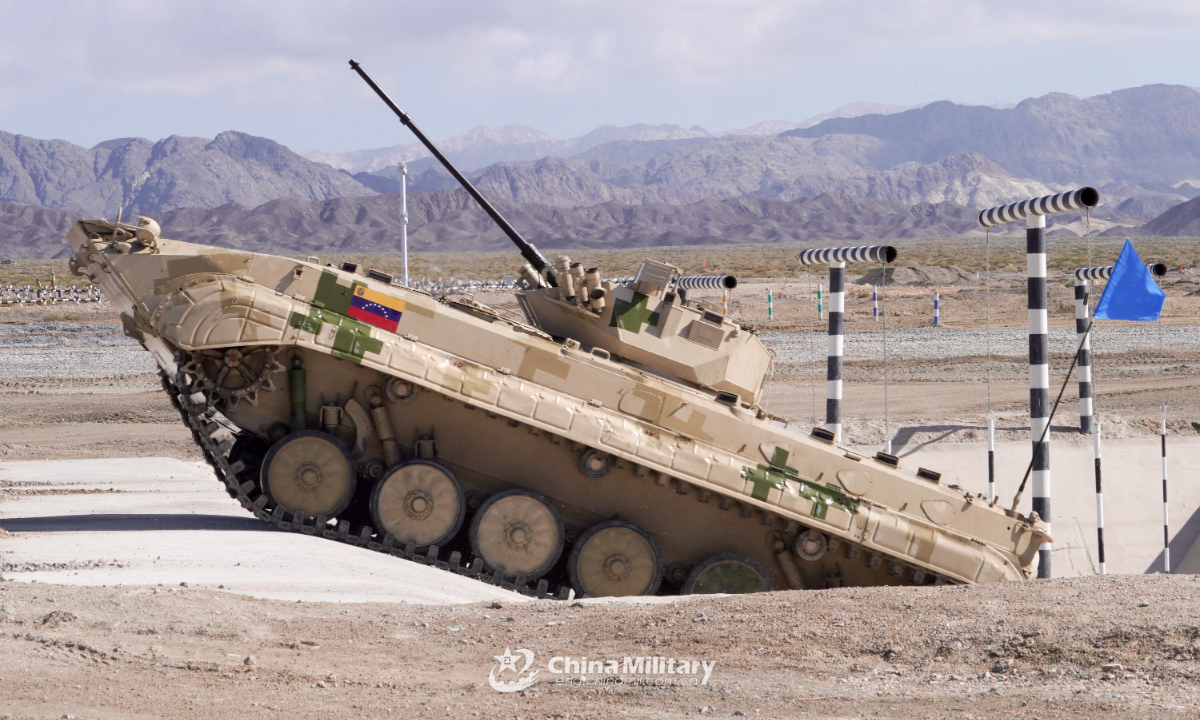 An infantry fighting vehicle of the Venezuelan team passes through an antitank ditch in the final round of individual race of Suvorov Onslaught contest in Korla, China's Xinjiang Uygur Autonomous Region, on August 18, 2022. Photo:China Military