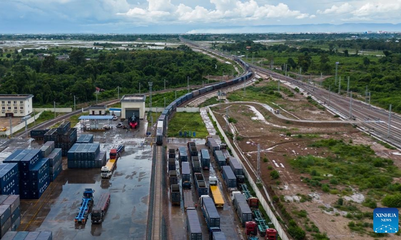Aerial photo taken on Aug. 9, 2022 shows cross-border goods being transported at Vientiane South Station of China-Laos Railway in Laos. The Laos-China Railway Co., Ltd. (LCRC), a joint venture based in Lao capital Vientiane responsible for the operation of the Railway's Lao section, told Xinhua Wednesday that since its opening last December, the cross-border goods transported by the China-Laos Railway have exceeded 1 million tons.(Photo: Xinhua)