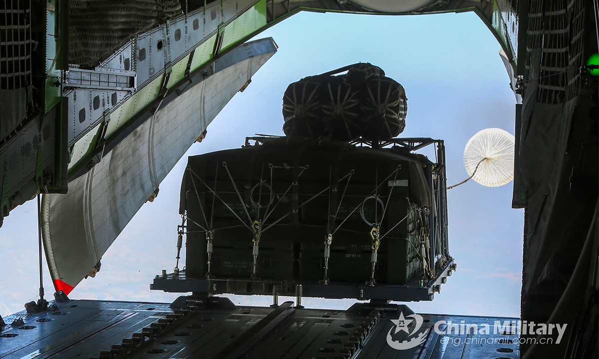 A pallet of packed heavy equipment is released from a transport aircraft in a heavy equipment airdrop drill held by an airborne unit of the PLA Air Force on July 21, 2022. (eng.chinamil.com.cn/Photo by Yang Jielin)