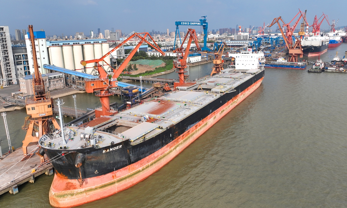 A cargo ship carrying 49,500 tons of sorghum imported from Argentina is unloaded at a wharf in Nantong, Jiangsu Province, on July 25, 2022. Photo: VCG