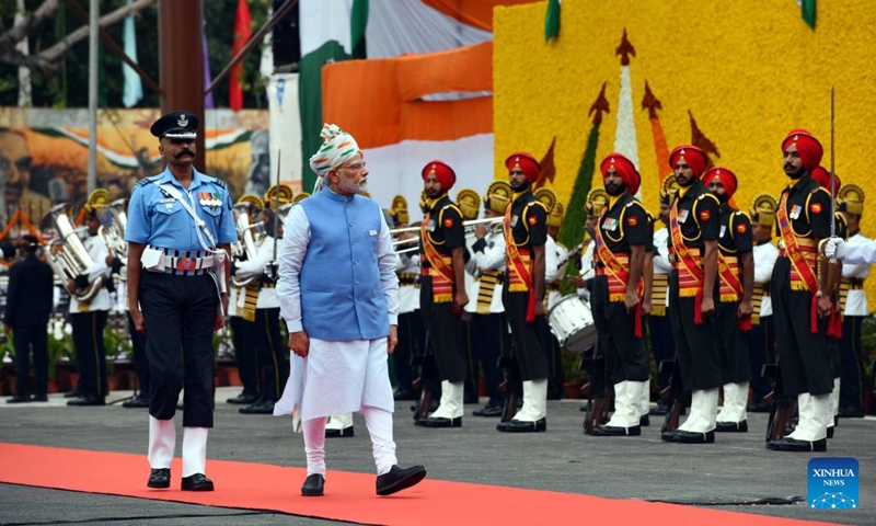 Indian Prime minister Narendra Modi inspects military guard of honor after arriving at the historic Red Fort on the occasion of India's Independence Day in Delhi, India, Aug. 15, 2022. (Str/Xinhua)