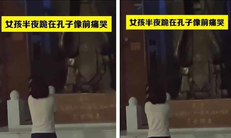 A girl kneels before the statue of Confucius and cries for her score at midnight on August 13, 2022. Screenshot of Netease News