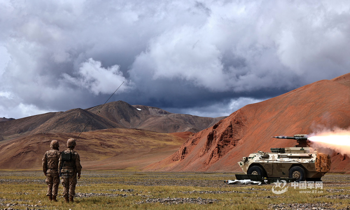A self-propelled anti-tank missile launcher attached to a combined-arms regiment under the PLA Xinjiang Military Command fires anti-tank missiles at a mock target precisely during a recent live-fire training exercise in a shooting range at the altitude of 5,200 meters. (eng.chinamil.com.cn/Photo by Gong Gaojie)
