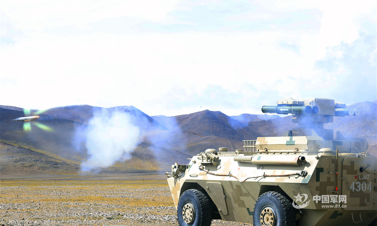 A self-propelled anti-tank missile launcher attached to a combined-arms regiment under the PLA Xinjiang Military Command fires anti-tank missiles at a mock target during a recent live-fire training exercise in a shooting range at the altitude of 5,200 meters. (eng.chinamil.com.cn/Photo by Chen Lin)