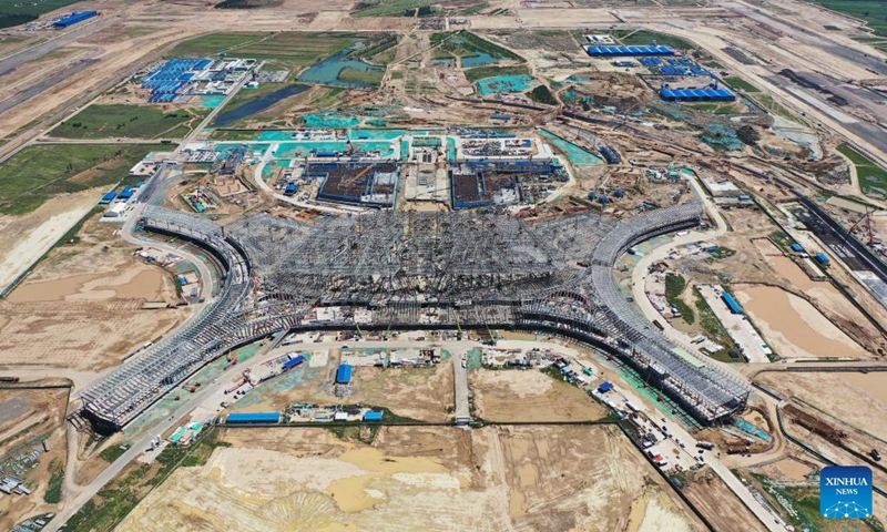 Aerial photo taken on Aug. 15, 2022 shows the construction site of a new airport in Hohhot, north China's Inner Mongolia Autonomous Region. The main structure of the terminal of a new airport in Hohhot has been completed. (Xinhua/Li Zhipeng)