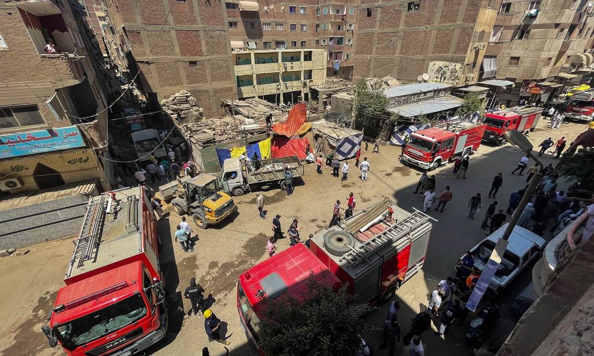 Civil protection personnel work at the scene after a fire tore through a Coptic Christian church on August 14, 2022 in the Imbaba neighborhood of Giza, Egypt. Photo: AFP