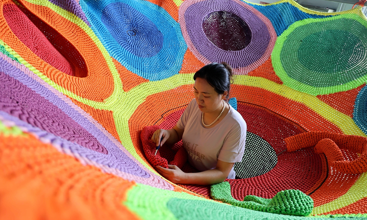 A worker manufactures sports ropes at a factory in Huimin county, East China's Shandong Province, on August 15, 2022. The county is the largest production base for chemical fiber ropes and it's also a sports industry base in China. It is home to over 2,000 rope factories. Photo: cnsphoto