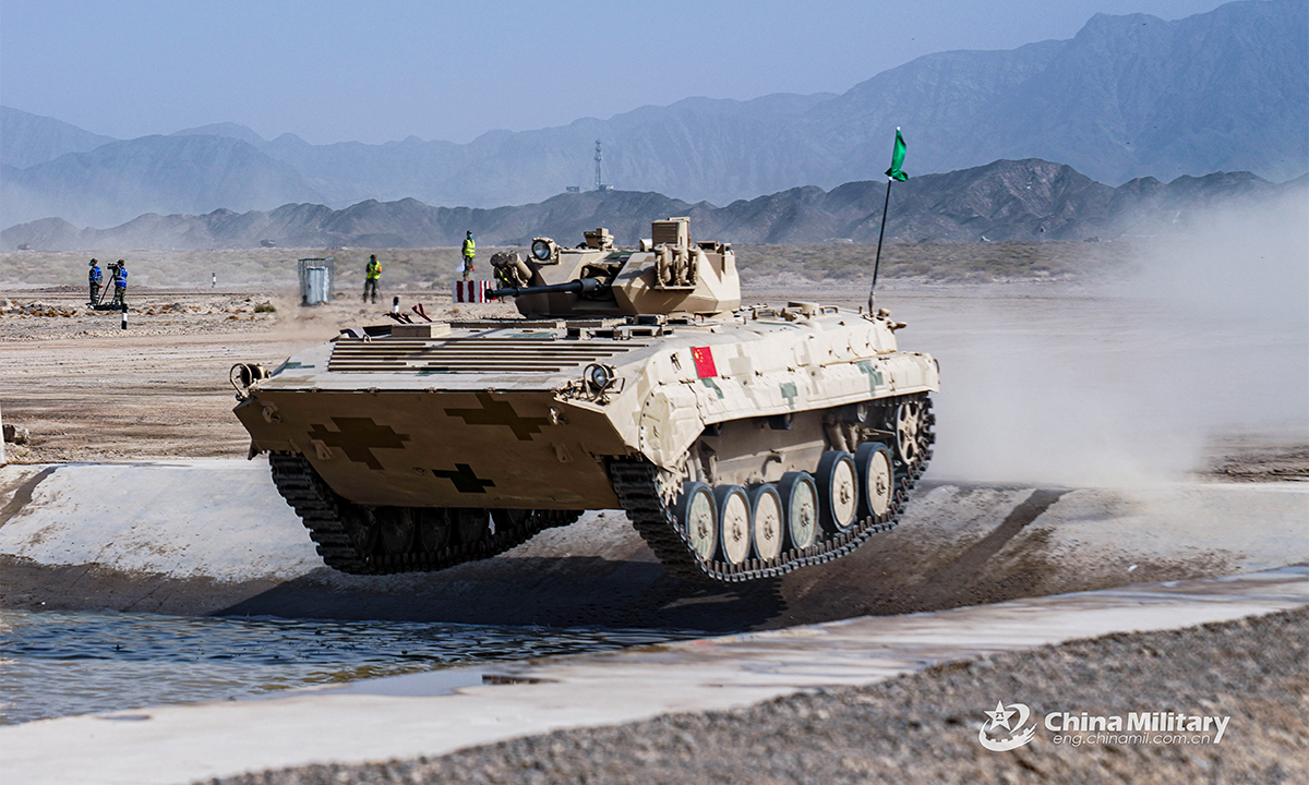 An infantry fighting vehicle of the Chinese team passes through a water barrier in the first round of individual race of the Suvorov Onslaught contest in Korla, China's Xinjiang Uygur Autonomous Region, on August 14, 2022. The Suvorov Onslaught of the International Army Games 2022 (IAG 2022) kicked off on August 14 with participation of six teams from five countries, namely China, Russia, Belarus, Iran and Venezuela. (Photo by Li Shuoxun)