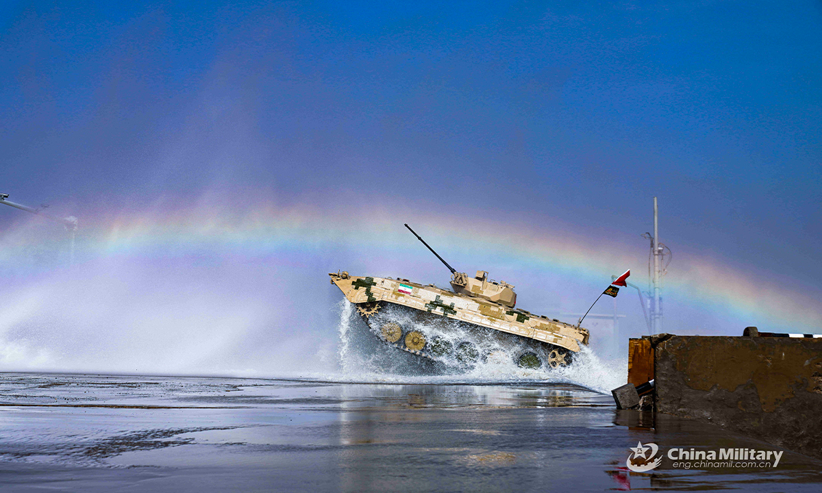 An infantry fighting vehicle of the Iranian team crosses a water barrier in the first round of individual race of the Suvorov Onslaught contest in Korla, China's Xinjiang Uygur Autonomous Region, on August 14, 2022. The Suvorov Onslaught of the International Army Games 2022 (IAG 2022) kicked off on August 14 with participation of six teams from five countries, namely China, Russia, Belarus, Iran and Venezuela. (Photo by Li Shuoxun)