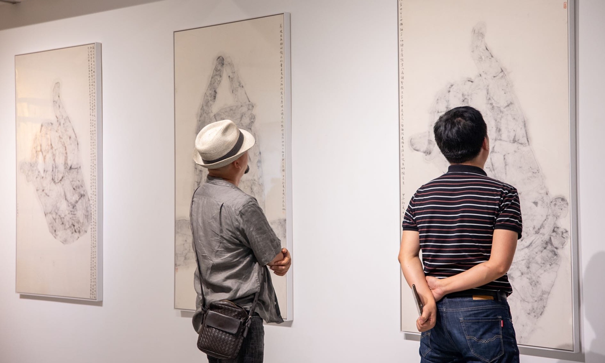 Visitors at the art exhibition Photo:Courtesey of Minerva Gallery 