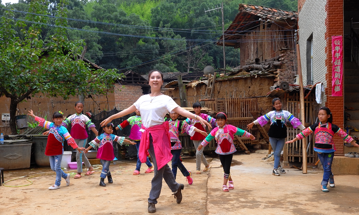 Zhang Ping teaches a dance class for children in Naaduo village, Yunnan Province. Photo: Courtesy of Guan Yu