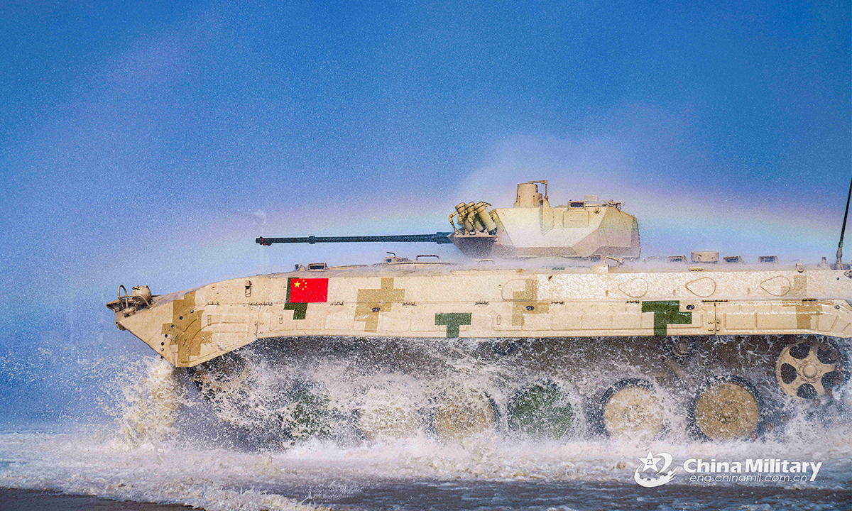 An infantry fighting vehicle of the Chinese team passes through a water barrier in the first round of individual race of the Suvorov Onslaught contest in Korla, China's Xinjiang Uygur Autonomous Region, on August 14, 2022. The Suvorov Onslaught of the International Army Games 2022 (IAG 2022) kicked off on August 14 with participation of six teams from five countries, namely China, Russia, Belarus, Iran and Venezuela. (Photo by Li Shuoxun)
