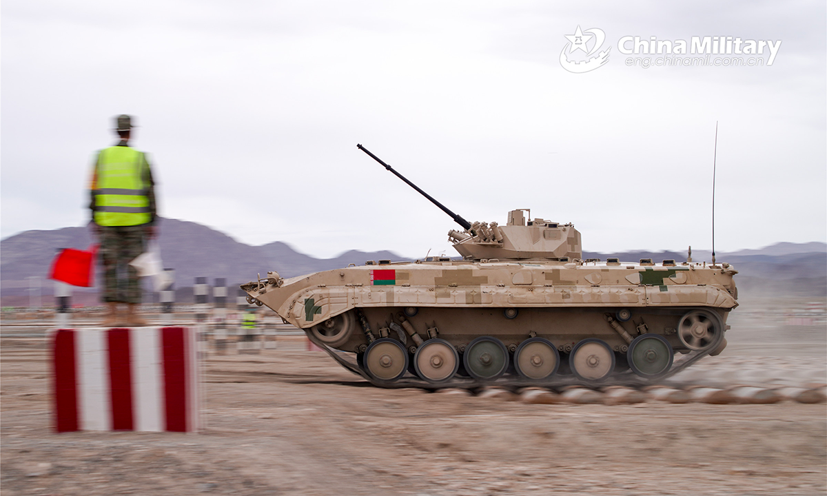 An infantry fighting vehicle of the Belarus participating team leaps forward through the bumps obstacle during the second round of individual race of the Suvorov Onslaught contest in Korla, China's Xinjiang Uygur Autonomous Region, on August 16, 2022. The Suvorov Onslaught contest of the International Army Games 2022 (IAG 2022) kicked off on August 14 with participation of six teams from five countries, namely China, Russia, Belarus, Iran and Venezuela. (Photo by Luan Cheng)