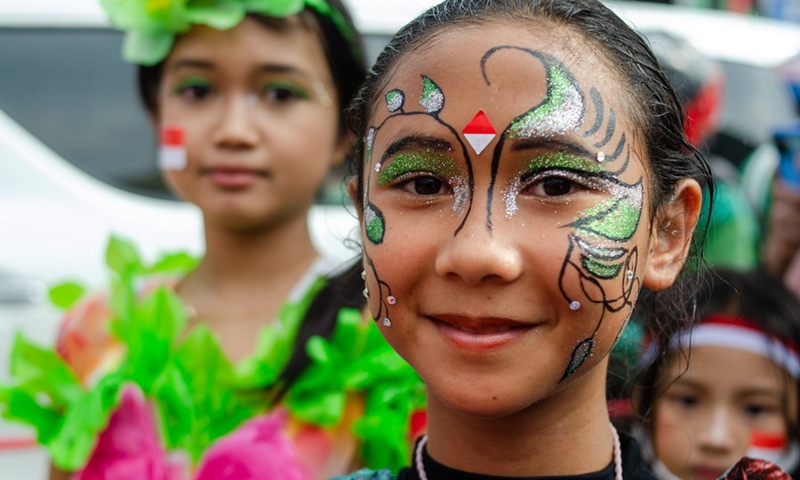 A girl posing for photographs participates in a cultural carnival ahead of the 77th Independence Day celebration in Lembang, Bandung, West Java, Indonesia, Aug. 16, 2022.(Photo: Xinhua)