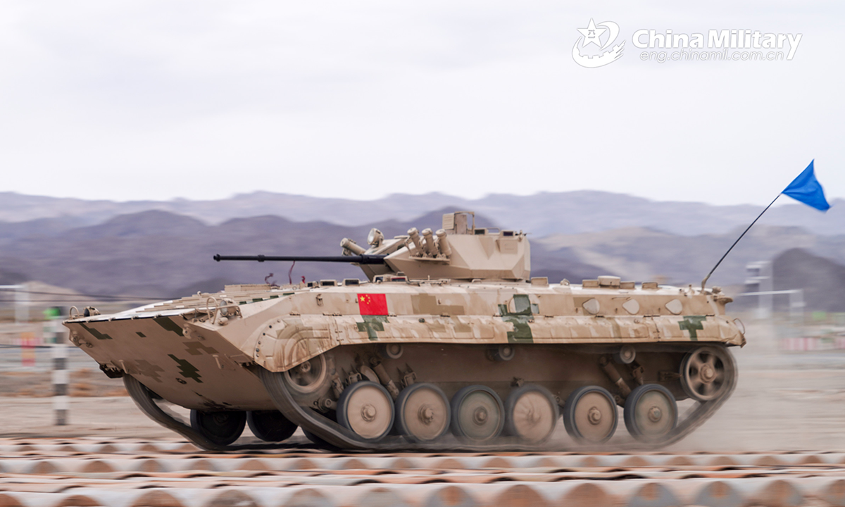 An infantry fighting vehicle of the Chinese team leaps forward on the treadway bridge setup during the second round of individual race of the Suvorov Onslaught contest in Korla, China's Xinjiang Uygur Autonomous Region, on August 16, 2022. The Suvorov Onslaught contest of the International Army Games 2022 (IAG 2022) kicked off on August 14 with participation of six teams from five countries, namely China, Russia, Belarus, Iran and Venezuela. (Photo by Luan Cheng)