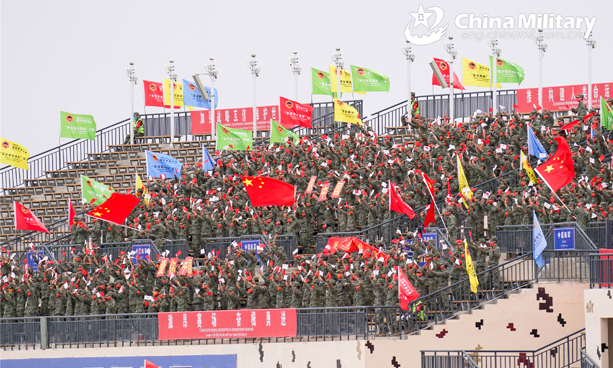 The spectators cheer for the participating teams during the Suvorov Onslaught contest in Korla, China's Xinjiang Uygur Autonomous Region, on August 16, 2022. The Suvorov Onslaught contest of the International Army Games 2022 (IAG 2022) kicked off on August 14 with participation of six teams from five countries, namely China, Russia, Belarus, Iran and Venezuela . (Photo by Luan Cheng)